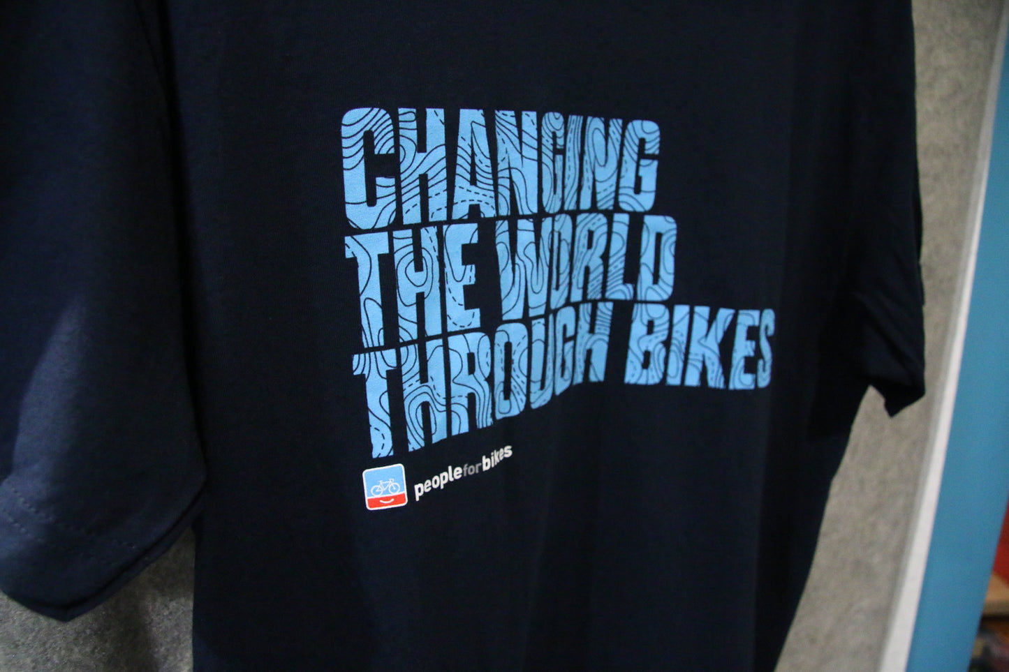 "Changing the World Through Bikes" Unisex Tee